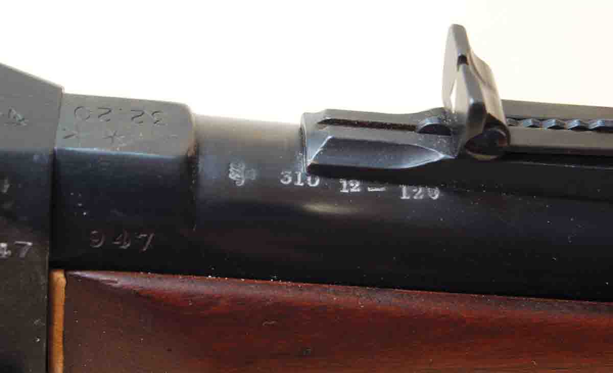The factory cartridge marking on this Australian .310 barrel is partially covered by an added rear sight.